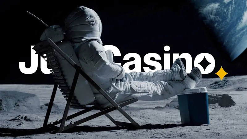 JustCasino astronaut relaxing on the moon beside the brand wordmark